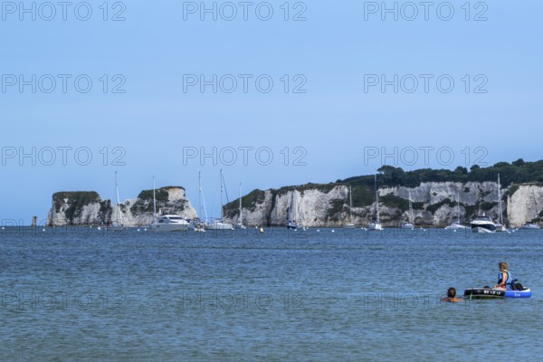 Boats on sea over Knoll Beach Studland, Poole, Dorset, England, United Kingdom