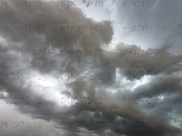 Dark discoloured storm clouds Cloud roll above grey clouds Rain clouds herald thunderstorms,