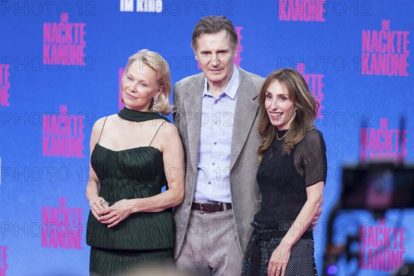 Pamela Anderson, Liam Neeson and Erica Huggins (producer) at the film premiere of The Naked Gun at