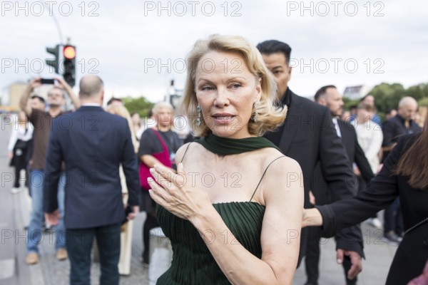 Pamela Anderson attends the film premiere of The Naked Gun at the UCI Luxe East Side Gallery,