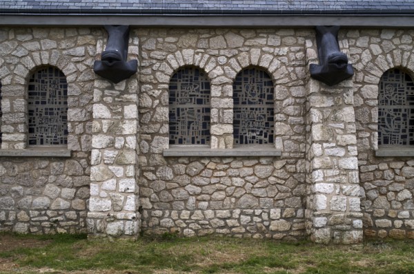 Side view, decorations, fish heads as gargoyles, church Chapelle Notre Dame de la Garde, Étretat,