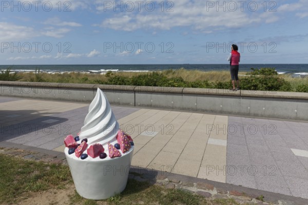 Decorative sundae with strawberries and icing on the cake, eye-catcher on the beach promenade,