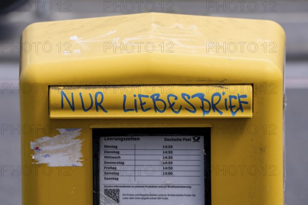 Deutsche Post letterbox, with stickers and graffiti, labelled Only love letters, Leverkusen, North
