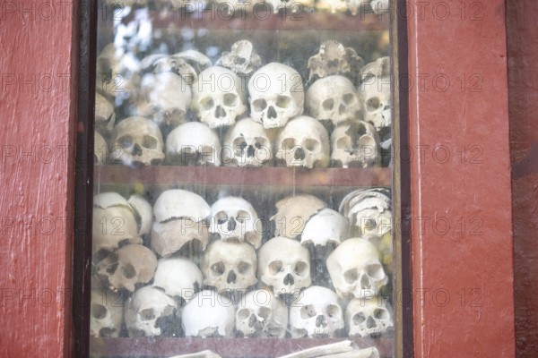 Shrine with human skull, memorial to the victims of the Khmer Rouge regime, Wat Thmei, Siem Reap,