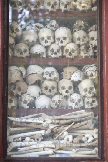 Shrine with human skull, memorial to the victims of the Khmer Rouge regime, Wat Thmei, Siem Reap,