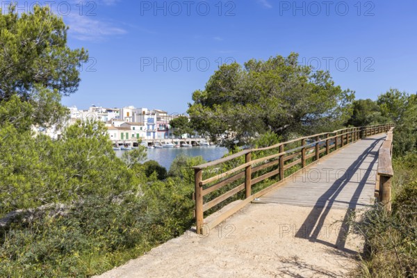 Portocolom fishing village on Majorca with boats and colourful houses Holiday by the sea in
