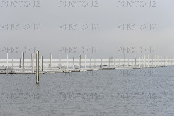 Winter day, onset of winter, snow on the jetties in the marina, North Sea, Norddeich, Lower Saxony,