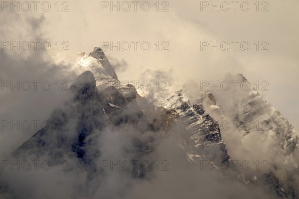 Small and large Bettelwurf with a thin layer of snow, behind wispy clouds, Small and large