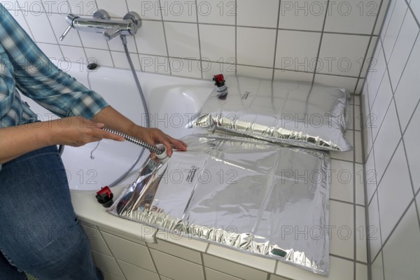 Filling a 10 litre water bag, for storing drinking water at home, as an emergency reserve in the