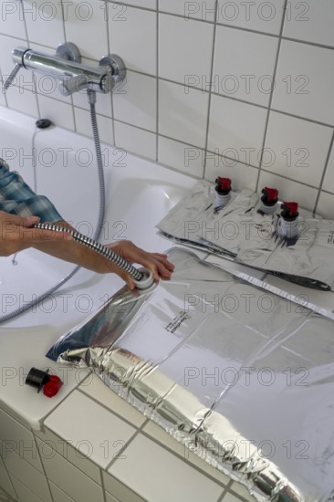 Filling a 10 litre water bag, for storing drinking water at home, as an emergency reserve in the