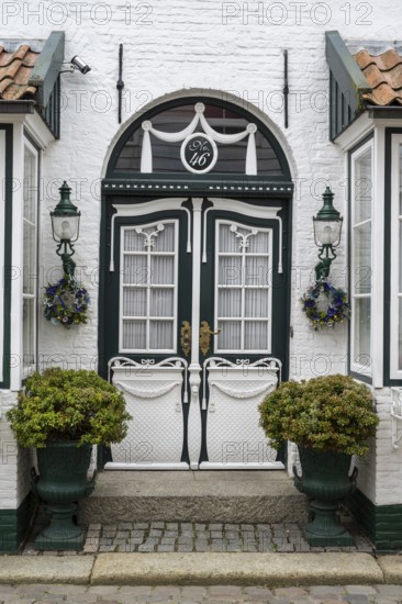 Beautiful ornate door with lamps, facade, Old Town, Husum, North Frisia, Schleswig-Holstein,