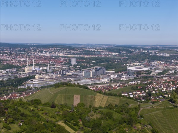 City panorama of Stuttgart with hills and vineyards, in the background the Mercedes-Benz plant in