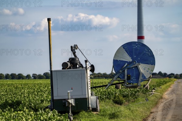 Mobile pump for artificial irrigation with a sprinkler system in a field where sugar beet is grown,
