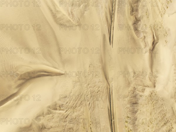Rails covered with sand in the southern Namib Desert. Aerial view. Drone shot. Namibia