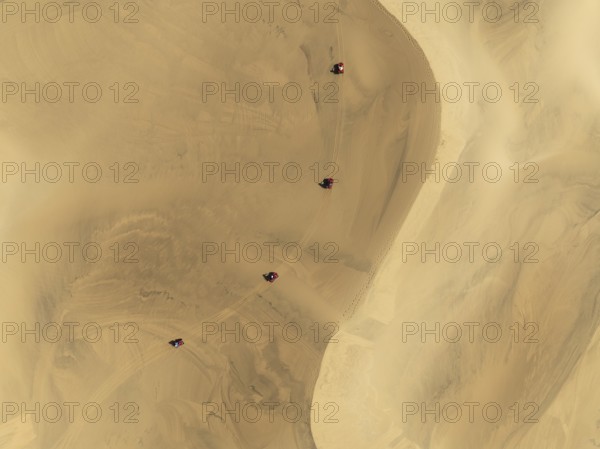 Quad bikes in the dunes of the Namib Desert in the vicinity of the coastal town of Swakopmund.