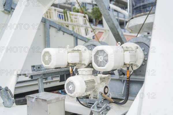 Close-up of technical machines and motors on a construction, Ferris wheel construction for the