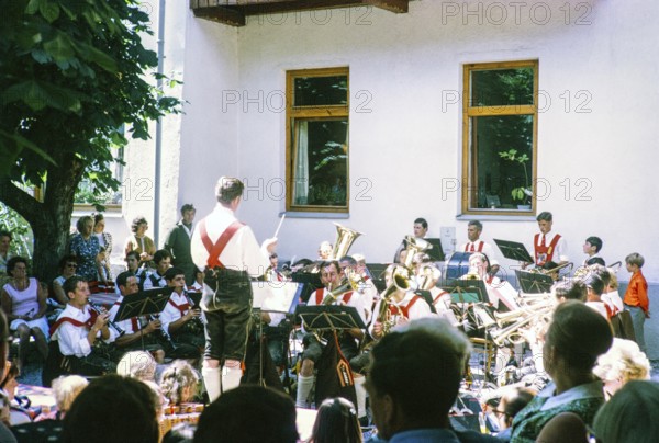 Male musical band performance wearing traditional clothes, Oetz, Imst district, Tyrol, Austria,