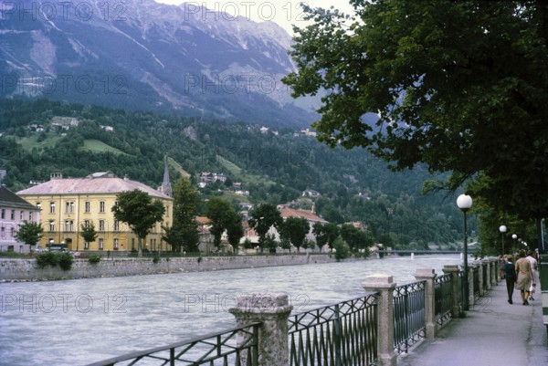 Historic waterfront buildings and pathway, River Inn, city of Innsbruck, Tyrol, Austria, Europe