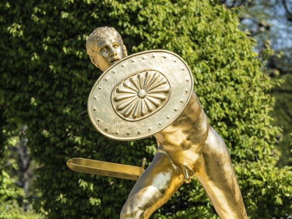 Golden sculpture, warrior with shield and sword, Herrenhausen Gardens, Baroque garden at castle