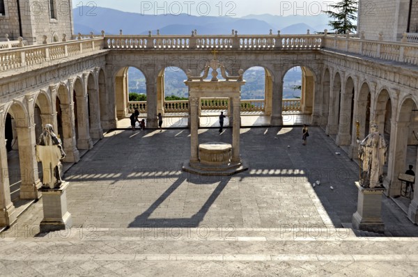 Bramante cloister with cistern and statues of St Benedict and St Scholastica of Nursia, Benedictine