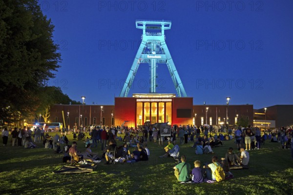 People in front of the German Mining Museum for the Extra Shift at night, Bochum, Ruhr Area, North
