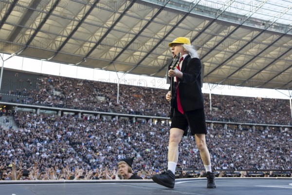 Angus Young, lead guitarist of AC/DC live on Power Up Tour 2025 at the Olympiastadion Berlin on 30