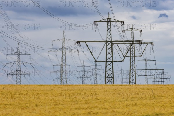 Many high-voltage power lines and lattice towers in the district of Ludwigsburg near Besigheim,