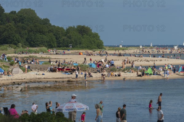Spectators of the windjammer parade 2025 on the Kiel Fjord at the end of the Kieler Woche, tall
