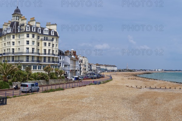 Beach and building on the seafront in Eastbourne, seaside resort on the English Channel, in the