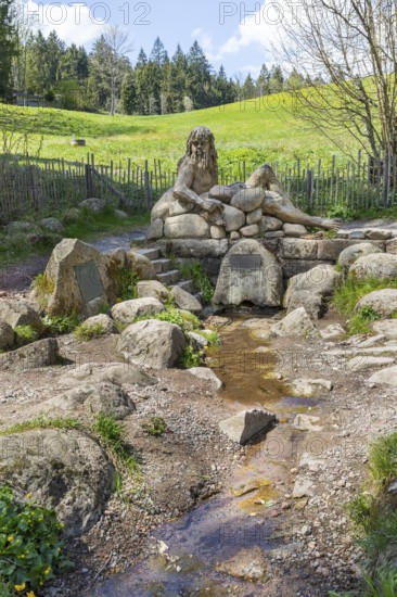Figure of the river god Danuvius by sculptor Wolfgang Eckert at the source of the Breg, source of