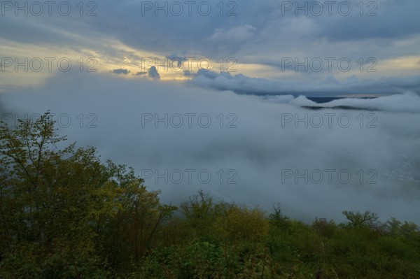 Foggy landscape with clouds and trees under a colourful morning sky, summer, Rhine bend Boppard,