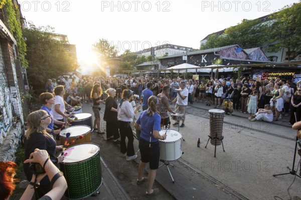The band Berlin Percussion plays on the RAW grounds as part of the Fête de la Musique. The music