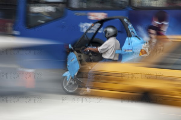 Man riding a motorcycle, Riding at high speed, Photo with motion blur, City of Quito, Pichincha