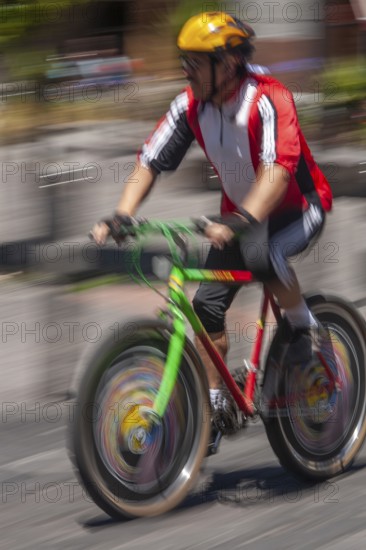 Man riding a bicycle, Photo with motion blur, City of Quito, Pichincha province, Ecuador, South