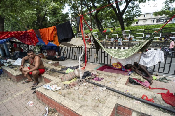 Devotees staying in street divider as they arrives to visit Kamakhya Temple during Ambubachi Mela,