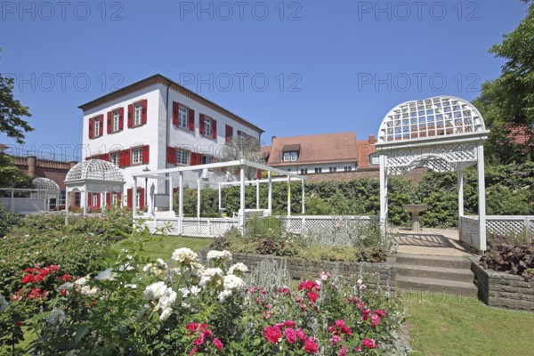 Rose garden and historic Klösterle house, garden with roses, flowers, pergola and arbour,
