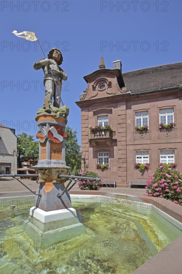 Sculpture of St George with lance, St George's fountain, dragon slayer, water basin, town coat of
