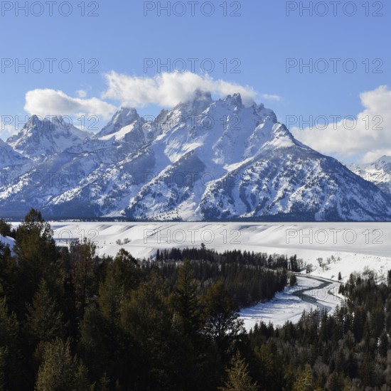 View over the Snake River... Teton Range (Rocky Mountains) in winter with snow, down in the valley
