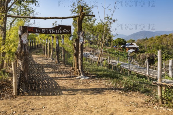 Walkway at the Akha Cottage coffee shop and restaurant in Chiang Rai Thiland asks What is your mood