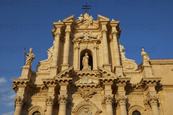 Cathedral of Syracuse, detailed view of the cathedral with sculptures and blue sky in the