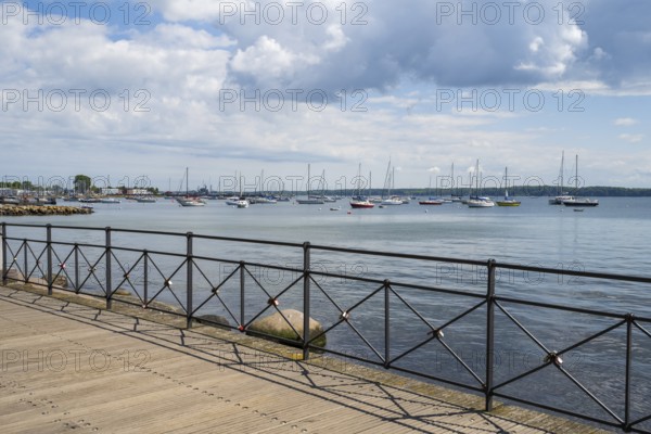 Sailboats in the harbour, promenade, dark clouds, Eckernförde, Baltic Sea, Schleswig-Holstein,