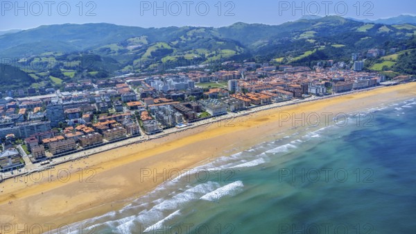 Aerial view of zarautz, gipuzkoa, showcasing the golden sands meeting the turquoise waves of the