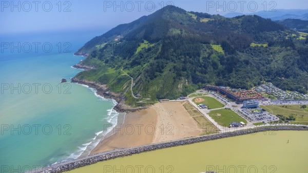 Aerial perspective captures the stunning coastal beauty of orio, spain, showcasing the beach,