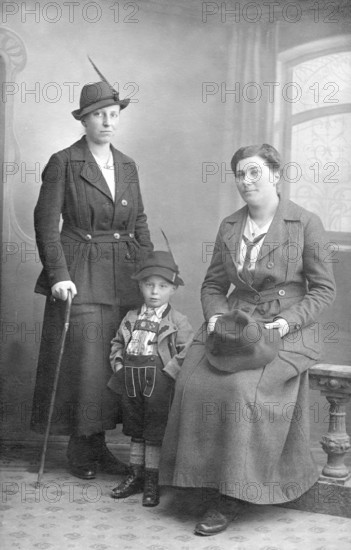 Family Bavaria, 1930s, Three people in traditional traditional costume pose for a portrait in a