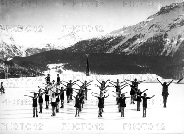 Children doing morning exercises in the snow around 1940, children practising in a choreographed