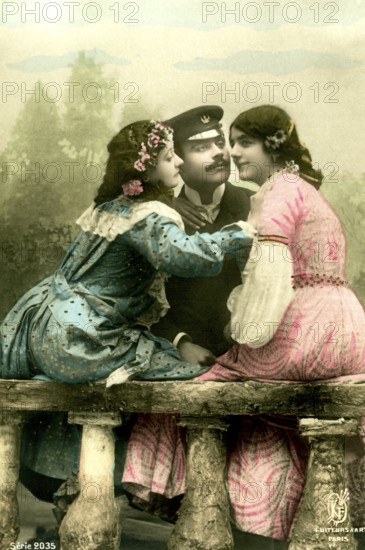 Man with 2 woman, 1920, Two woman in colourful dresses and a man in uniform sitting in