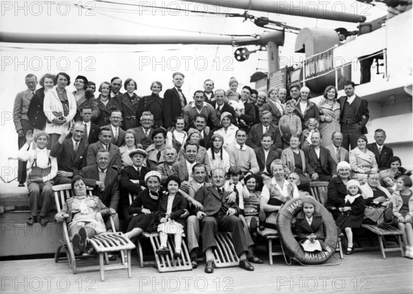 Group on ship deck, 1920s, Large group of people posing on a ship for a joint photo, Historical