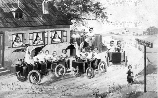 Two storks and a bunch of babies, 1920s, Children driving miniature cars on a rural road in a