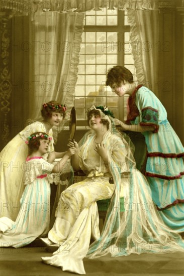 Bride bridesmaids, 1910s, woman and a girl in historical dress with mirror in an elegant room with