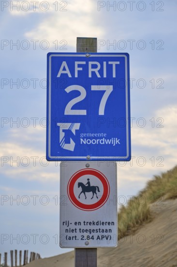 Two beach signs with a note, at the edge of the dunes, beach section 27, Noordwijk, North Sea,